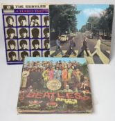 Fifteen The Beatles related albums, including, the White Album; No.0331437 (with three photo cards