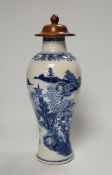 A Chinese Qianlong blue and white vase with wooden cover, 31.5cm