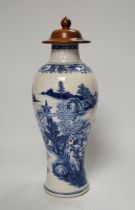 A Chinese Qianlong blue and white vase with wooden cover, 31.5cm