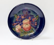 A Moorcroft, Sally Tuffin ‘Finches’ plate, stamped to base, 26cm diameter