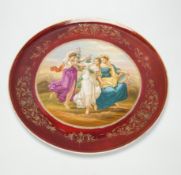 A Vienna style red porcelain charger, 40cm diameter