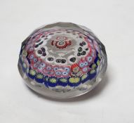 A 19th century French faceted glass paperweight, 8cm diameter