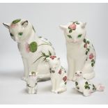 A Plichta clover pattern cat, a Plichta thistle pattern cat, together with two small Plichta cats