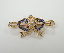 A yellow metal, sapphire and diamond set twin hearts bar brooch, 41mm, gross weight 4.8 grams.
