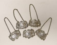 A matched set of five early 19th century ornate silver fruiting vine wine labels, Emes & Barnard,