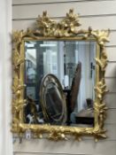 A Victorian style rectangular wall mirror with leaf and branch borders width 65cm, height 85cm.