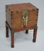 A Chinese brass mounted elm box on stand, width 42cm, depth 31cm, height 59cm