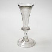 An English lead crystal baluster toastmaster’s glass, c.1710-20, elongated trumpet deceptive bowl on