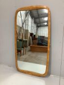 A mid century maple framed wall mirror, width 96cm, height 176cm