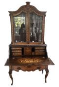 An early 19th century and later Dutch oak and walnut floral marquetry inlaid bureau bookcase,