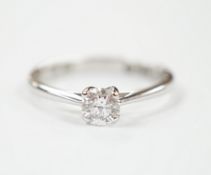 An 18ct white gold and solitaire diamond ring, the stone weighing 0.50ct, size R, gross weight 3.6