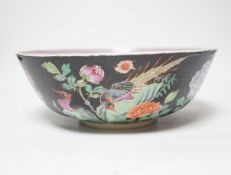 A 19th century Chinese famille noire bowl, 26cm diameter