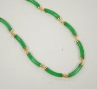 A 14k yellow metal and curved jade link necklace, 42cm, gross weight 25 grams.
