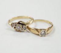 Two 9ct gold and diamond set rings including three stone and solitaire, gross weight 4.2 grams.