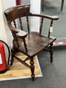 A Victorian style smoker's bow elbow chair, width 72cm, depth 47cm, height 84cm