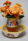 A Clarice Cliff Crocus pattern jug and basin, chamber pot and teapot with cover missing, basin