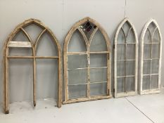 A pair of Victorian pine Gothic arched windows, one partially glazed the other with losses, width