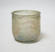 A Roman iridescent glass cup or tumbler, probably 2nd century AD, 7cm