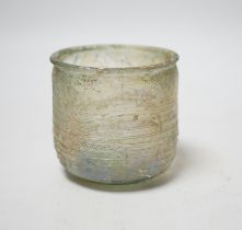 A Roman iridescent glass cup or tumbler, probably 2nd century AD, 7cm