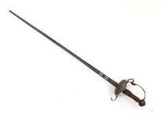 A mid 17th century English rapier, with pierced steel cup guard, loop guard and top of blade,