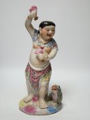 A Chinese famille rose porcelain figure of Liu Hai, stamp to base, 39cm