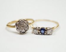 A 1920's 18ct, plat and diamond cluster set flower head ring, size M/N and a 18ct and plat. sapphire