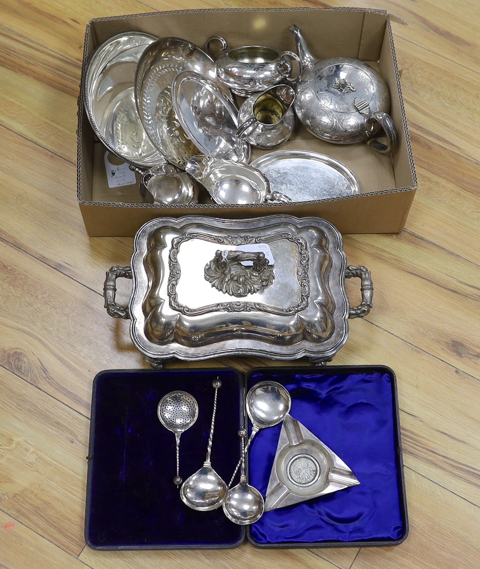 A collection of plated wares: an oval card tray, tureen and cover, cased four piece spoon desert set