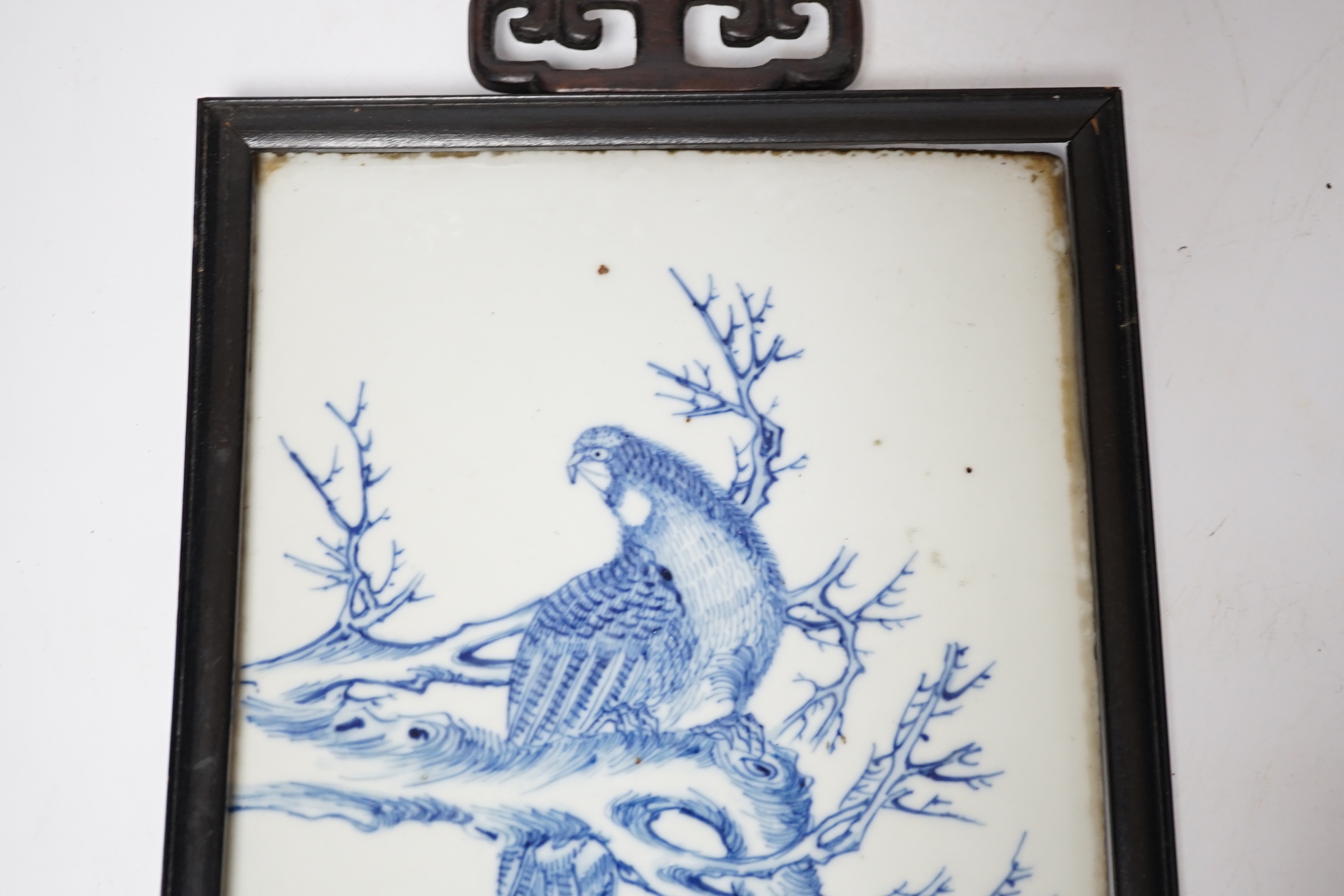 A late 19th century Chinese blue and white plaque of a bird, ebonised frame, 19cm wide x 30cm high - Image 2 of 4