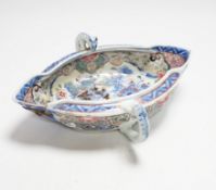 A Chinese clobbered blue and white double lipped sauceboat, Qianlong period, 23cm high