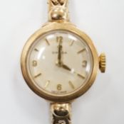 A lady's 9ct gold Omega manual wind wrist watch, on an associated 9ct gold bracelet, gross weight