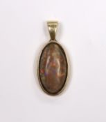 A yellow metal mounted oval black opal pendant, overall 30mm, gross weight 4 grams.