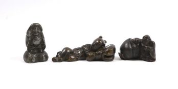 Two 19th century Japanese bronze scroll weights and an antimony figure, largest 7cm