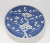 A 19th century Chinese blue and white Prunus dish, 33cm diameter