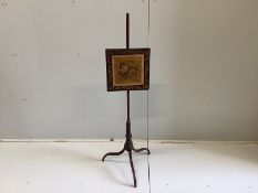 A George III mahogany polescreen with painted canvas panel, height 125cm