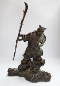 A 19th century Japanese bronze figure of a warrior, raised on naturalist bronze base, 40cm high
