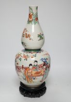 A Chinese enamelled porcelain double-gourd vase on hardwood stand, 41cm total height