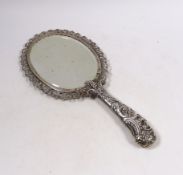 An ornate late Victorian silver mounted hand mirror, Edward Brown, London, 1891, 30.1cm.