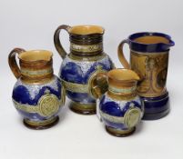 Three graduated Doulton Lambeth Queen Victoria diamond Jubilee commemorative jugs and a Nelson and