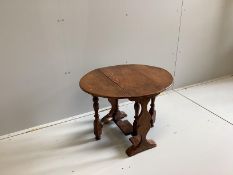 An 18th century style oak drop flap occasional table, width 60cm, depth 29cm, height 50cm