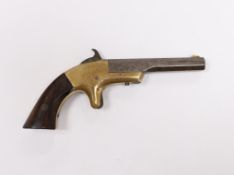 A 19th century miniature percussion pistol with brass lock and octagonal barrel, stamped Morgan