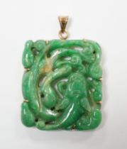 A yellow metal mounted jade pendant, carved with a fish, of square form, 37mm.