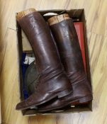 A collection of militaria, including; a pair of First World War military leather boots with wooden