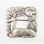 A Georg Jensen sterling kneeling deer and squirrel square brooch, design no. 318, 38mm.