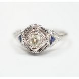An 18ct and single stone diamond set ring, with two stone triangular sapphire set shoulders, size P,