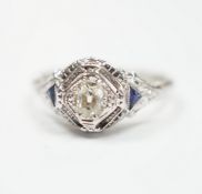 An 18ct and single stone diamond set ring, with two stone triangular sapphire set shoulders, size P,