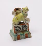 An 18th century Chinese enamelled blanc de chine 'cat' joss stick holder, 7cm