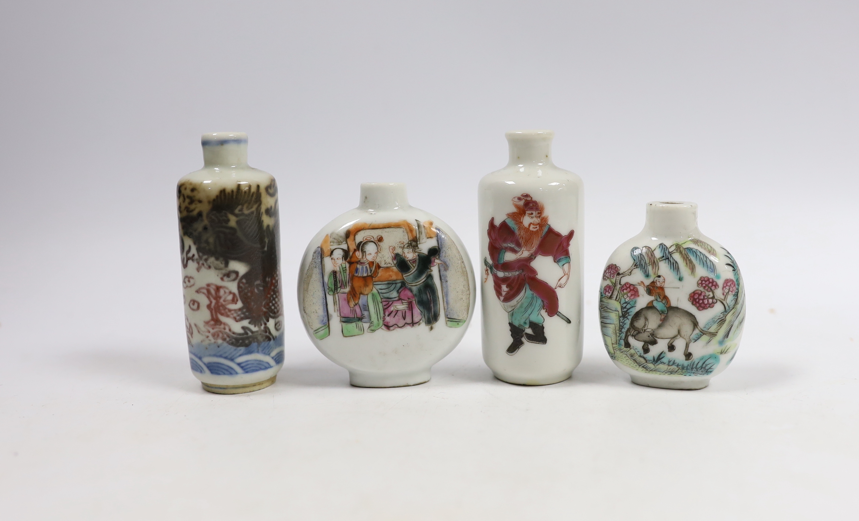 Three 19th century Chinese famille rose snuff bottles, and an underglaze copper red ‘Dragon’ snuff