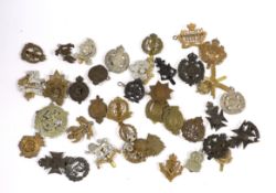Forty military cap badges including City of London Cyclists, Lincolnshire Yeomanry, Connaught