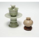 A Chinese celadon glazed 'dragon' puzzle cup and stand, early 20th century and a Chinese crackle