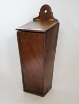 A 18th / 19th century oak candle box, 38cm high